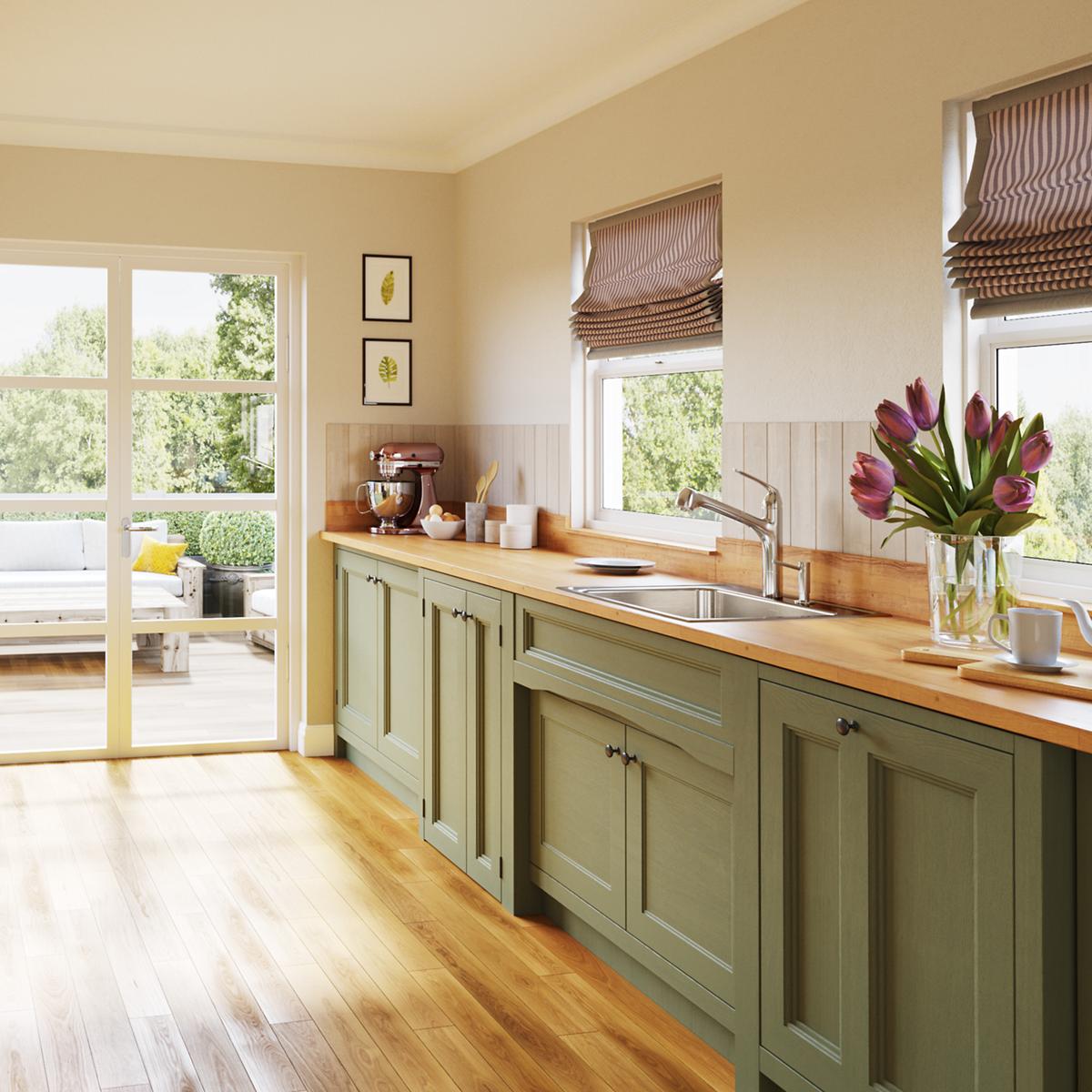 Stainless steel single bowl drop-in sink with brushed finish mounted in wooden countertop in kitchen setting.