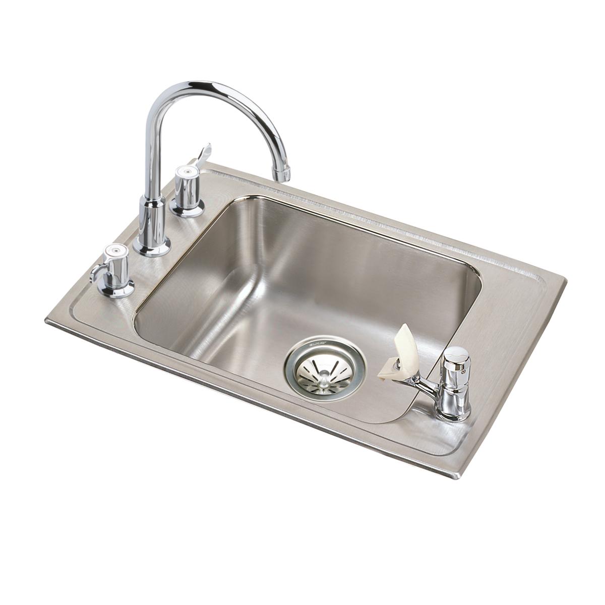 Stainless steel drop-in sink with single bowl, chrome faucet, and side-mounted soap dispenser on brushed surface.