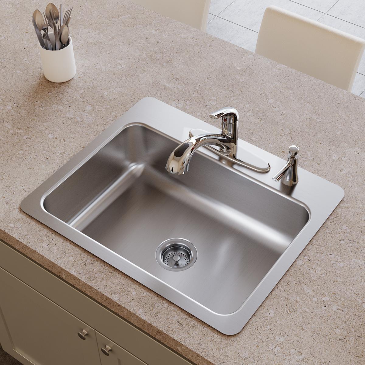 Stainless steel single bowl sink with white rim, two faucet holes, and drain strainer on countertop.