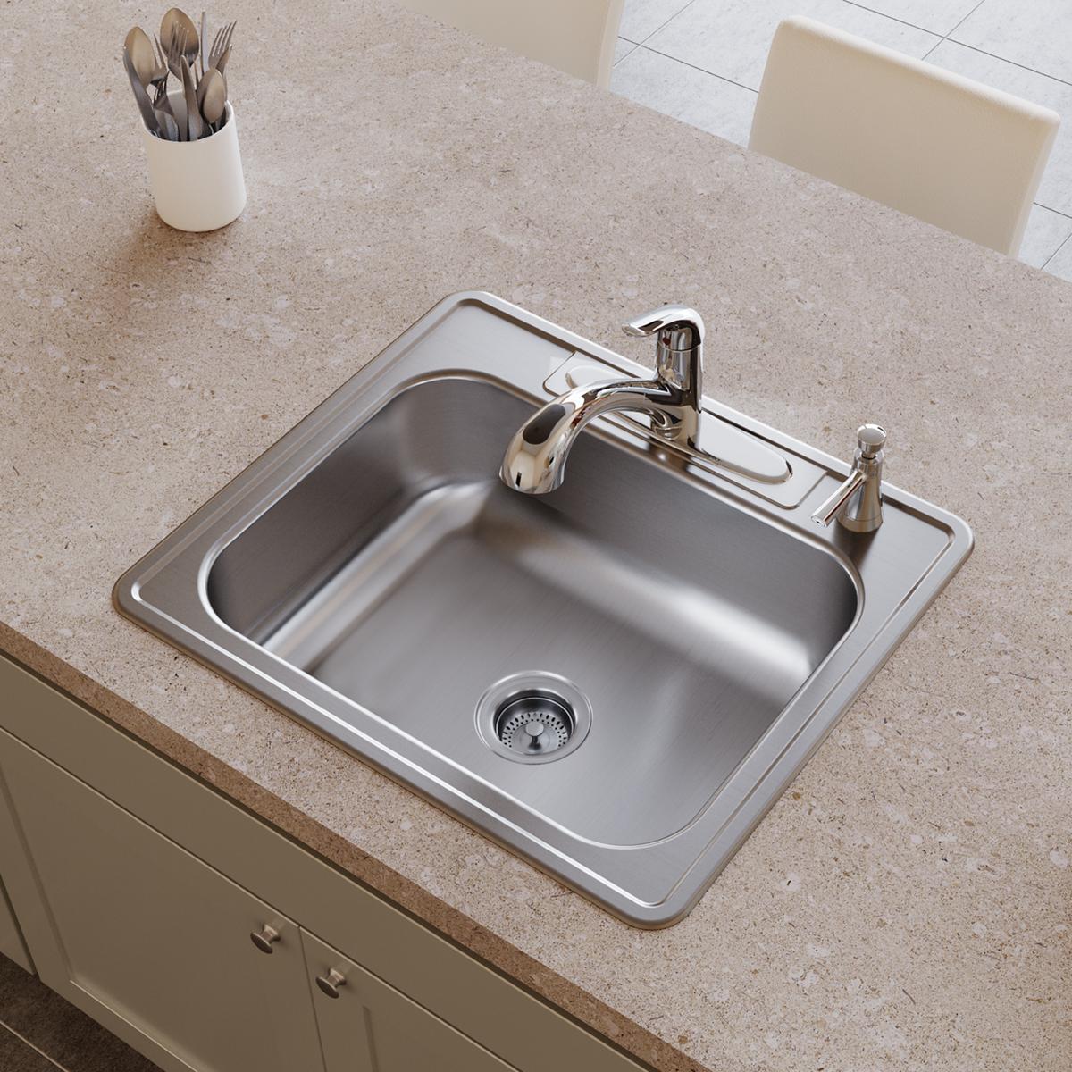 Stainless steel drop-in sink with single bowl, drain strainer, and faucet mounted on beige countertop.
