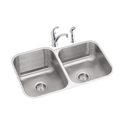 Stainless steel double bowl undermount sink with chrome faucet and spray attachment.