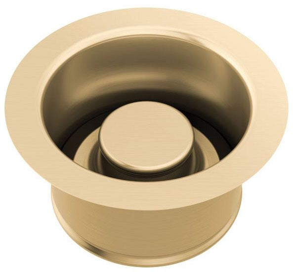 Champagne-colored round disposal flange with matching cylindrical stopper insert.