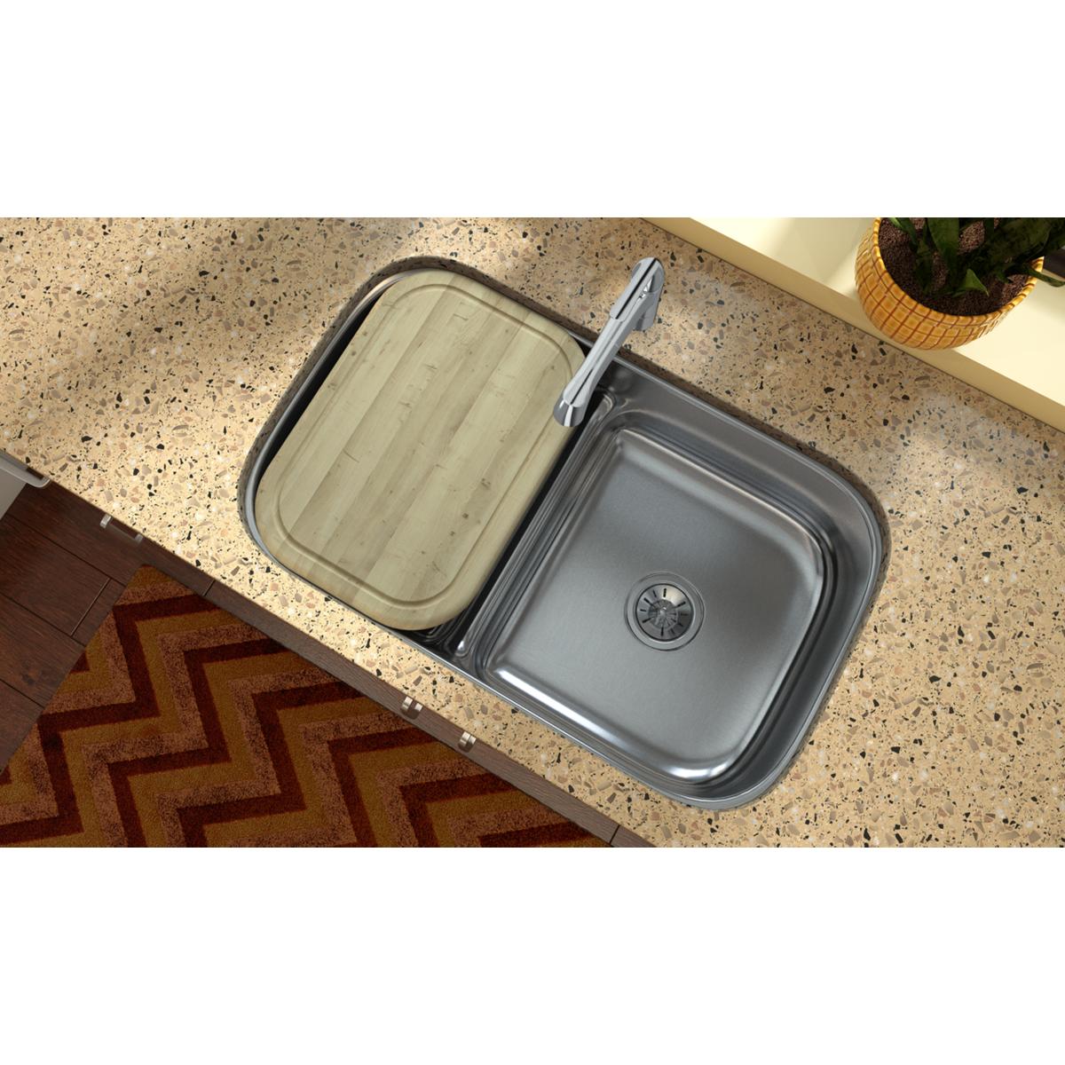 Tan hardwood cutting board with rounded corners positioned over a kitchen sink.