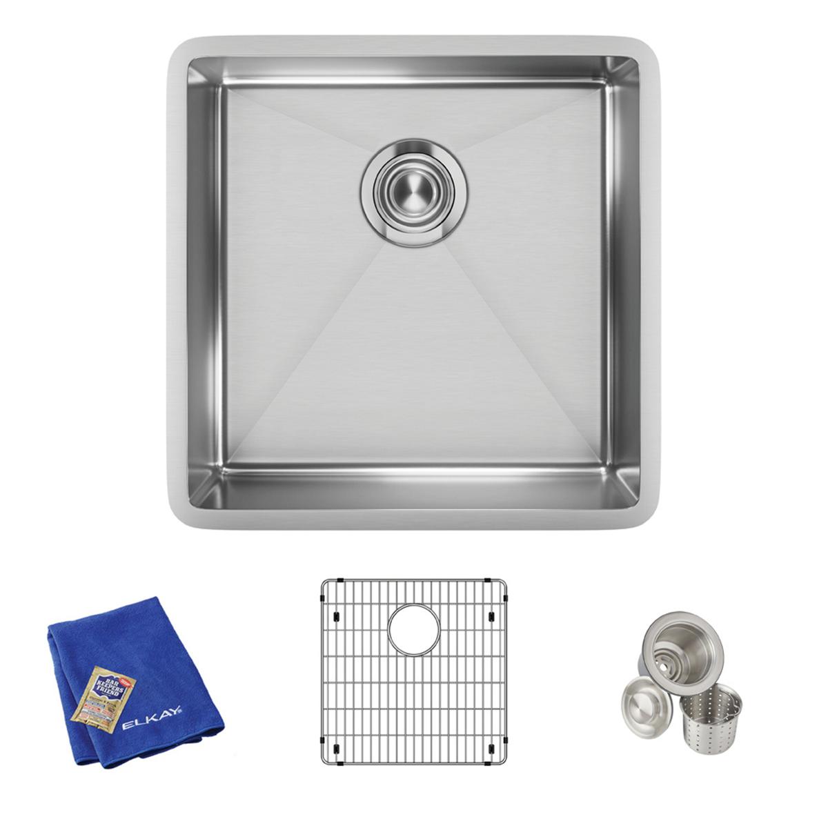 Stainless steel single bowl undermount sink with drain opening, shown with grid protector, strainer baskets, and blue cloth.