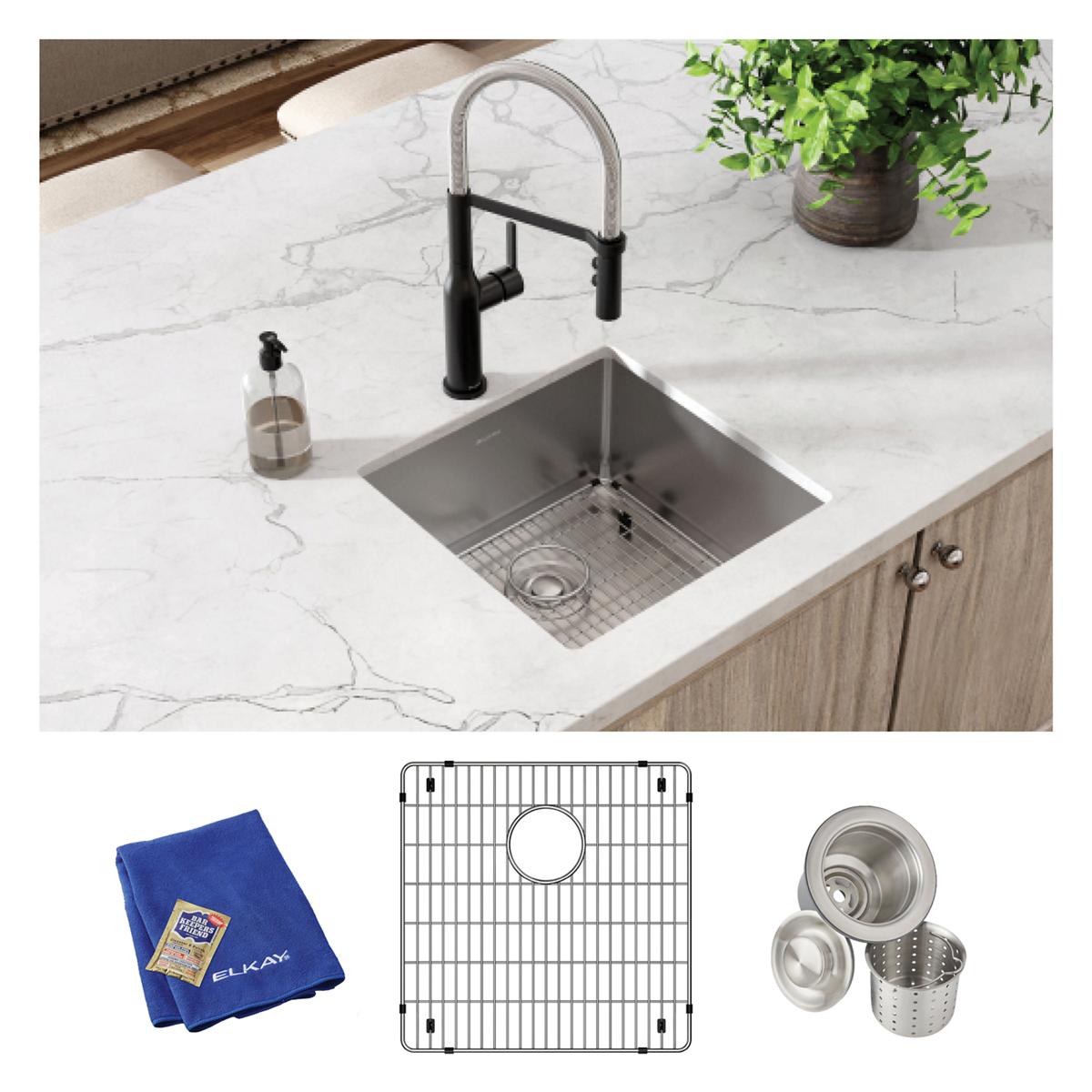 Stainless steel square undermount sink installed in white countertop with black faucet, includes grid, strainer basket, and b