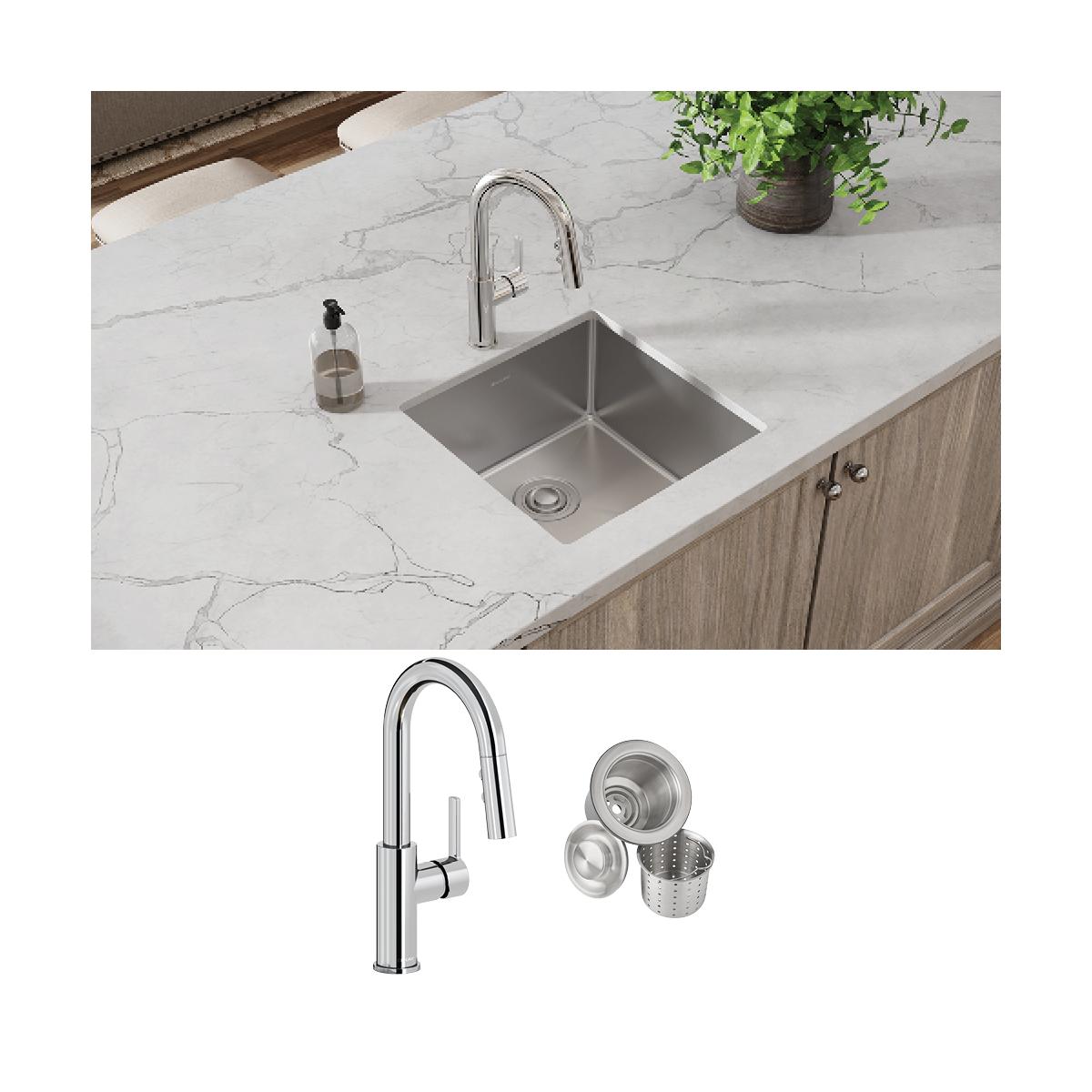 Stainless steel undermount sink with chrome pull-down faucet and drain accessories installed in marble countertop.
