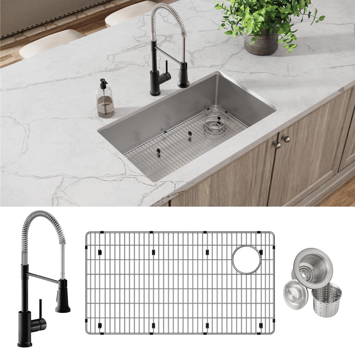 Stainless steel undermount sink with single bowl, black pull-down faucet, bottom grid, and drain strainer installed in marble