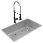 Stainless steel single bowl undermount sink with grid and drain, paired with black pull-down faucet.