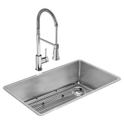Stainless steel rectangular undermount sink with grid rack and chrome pull-down faucet with coiled hose.