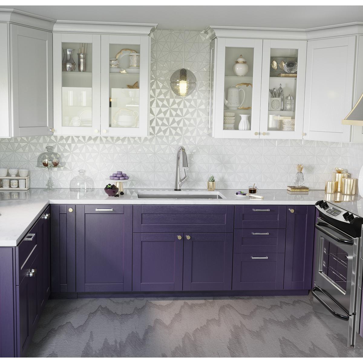 Stainless steel undermount sink with filtered faucet installed in purple and white kitchen cabinet with white countertop.