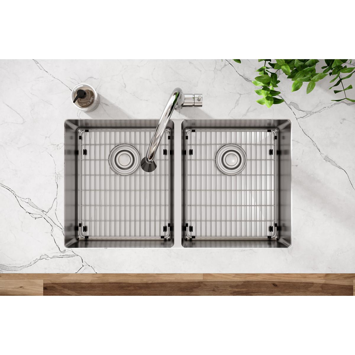 Stainless steel double bowl undermount sink with equal-sized basins, drain strainers, and included faucet, shown from above i
