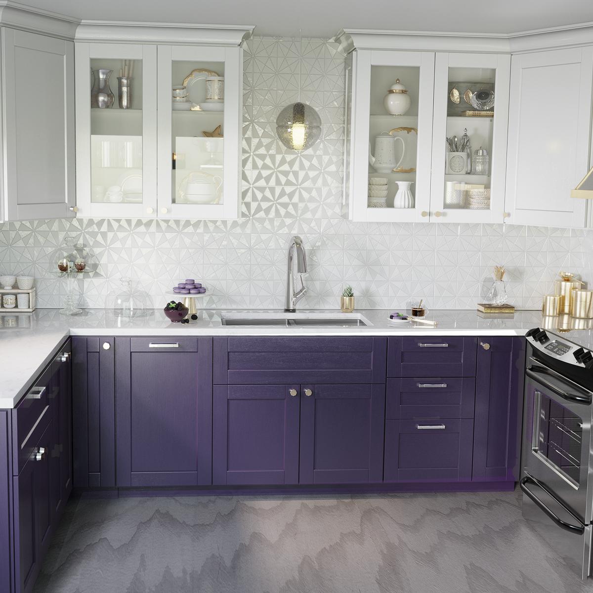 Stainless steel double bowl undermount sink with chrome filtered faucet installed in purple kitchen cabinetry.