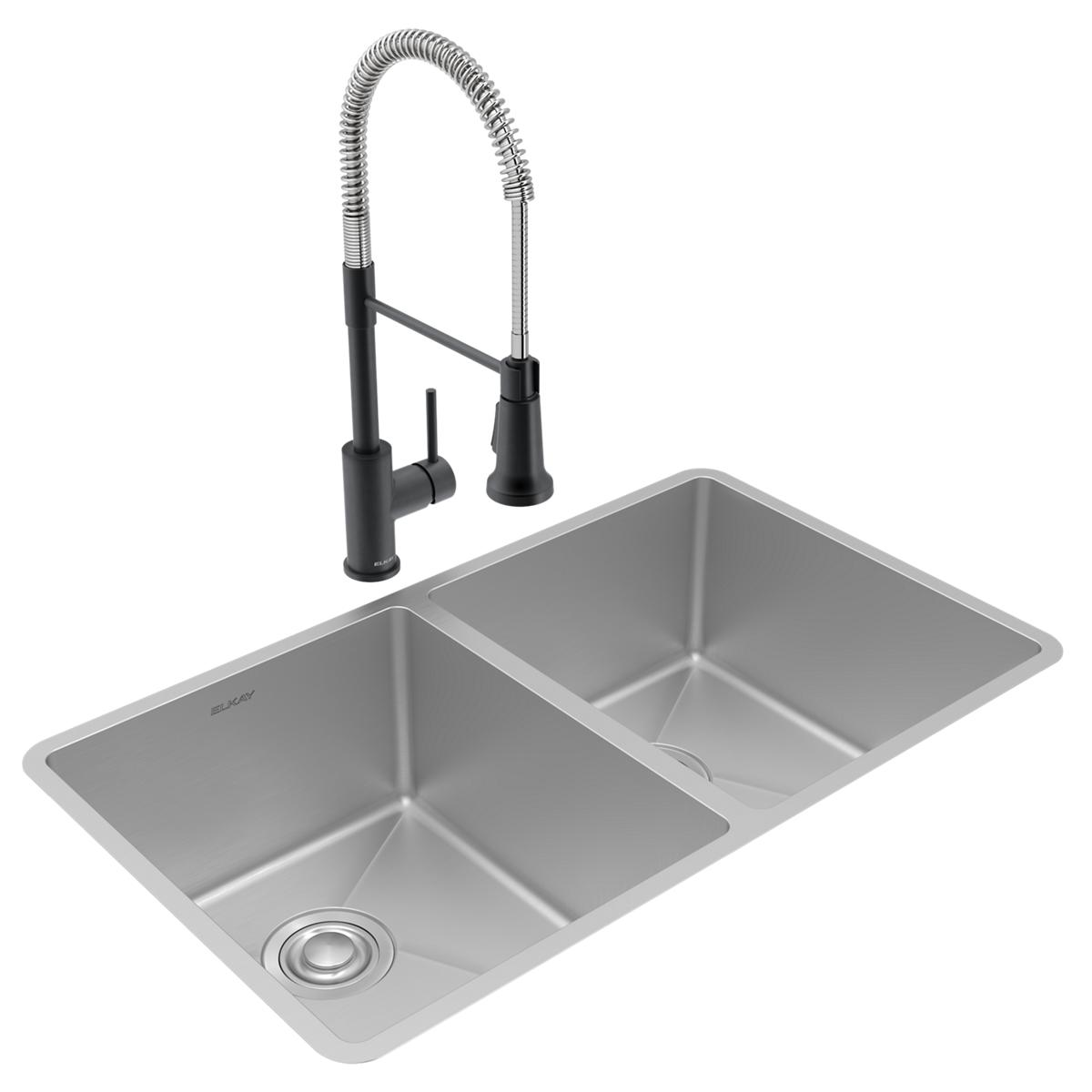 Stainless steel double bowl undermount sink with black pull-down faucet and drain assembly.