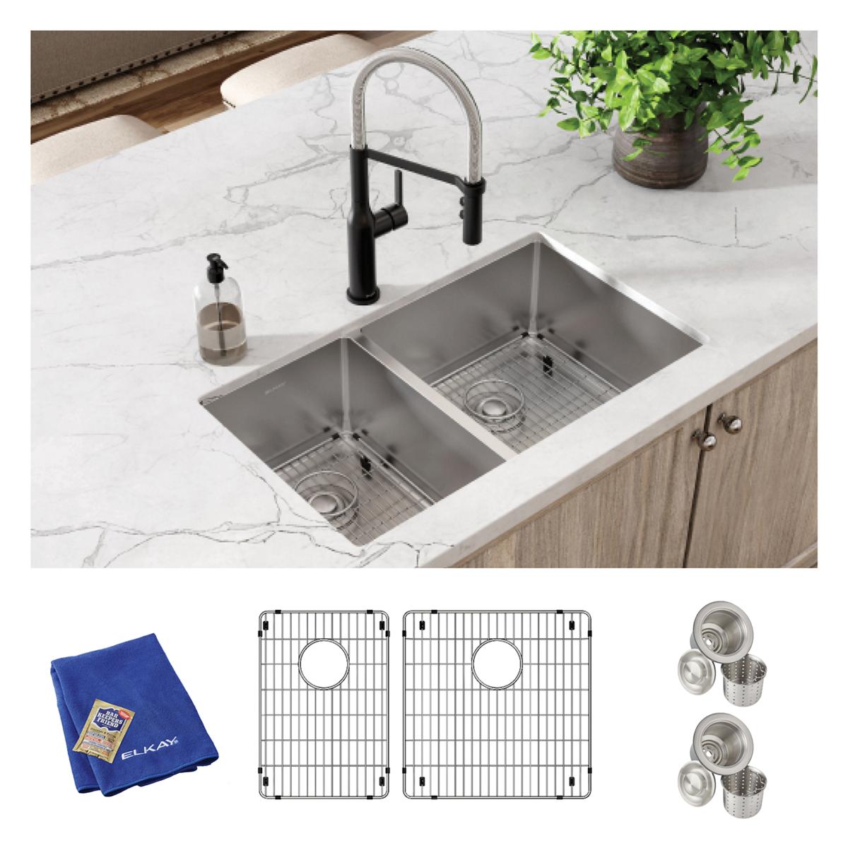 Stainless steel double bowl undermount sink with two grid inserts, strainer baskets, and blue drying cloth.