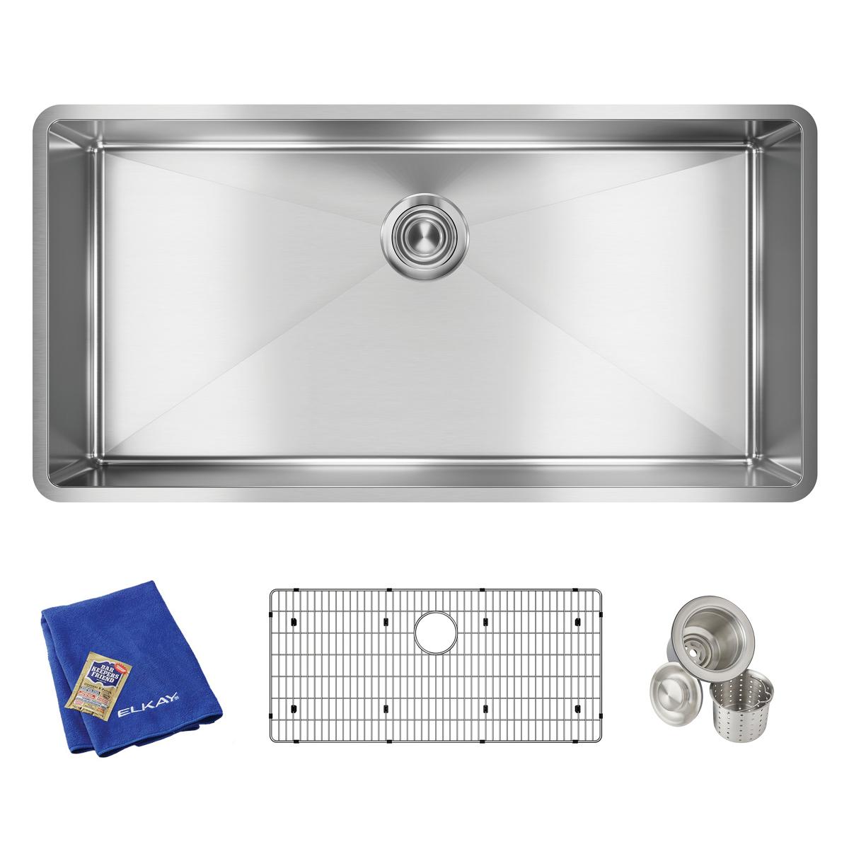 Stainless steel single bowl undermount sink with drain hole, shown with included grid strainer, blue cloth, and accessories.