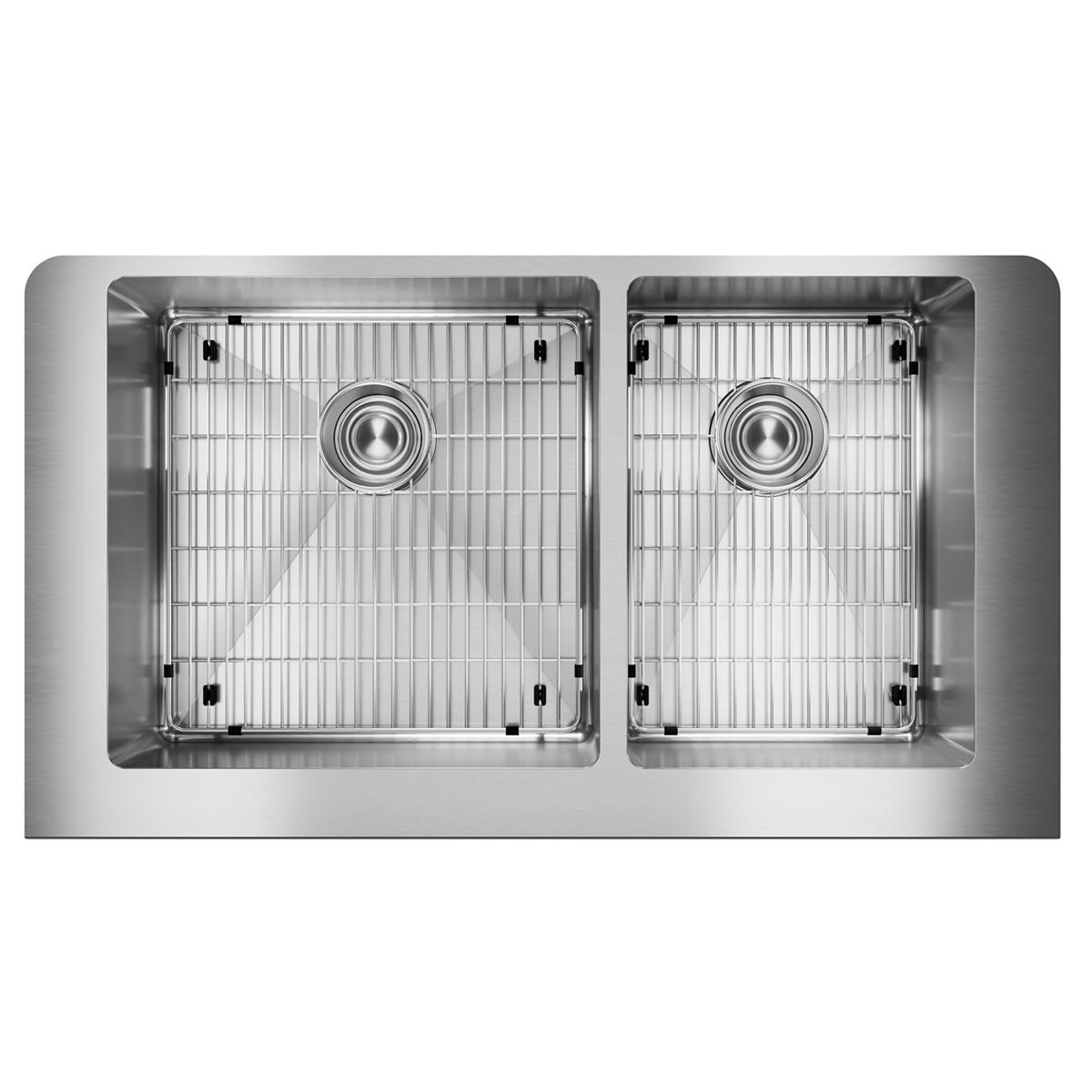Stainless steel double bowl farmhouse sink with two unequal basins, drain holes, and metal grids.