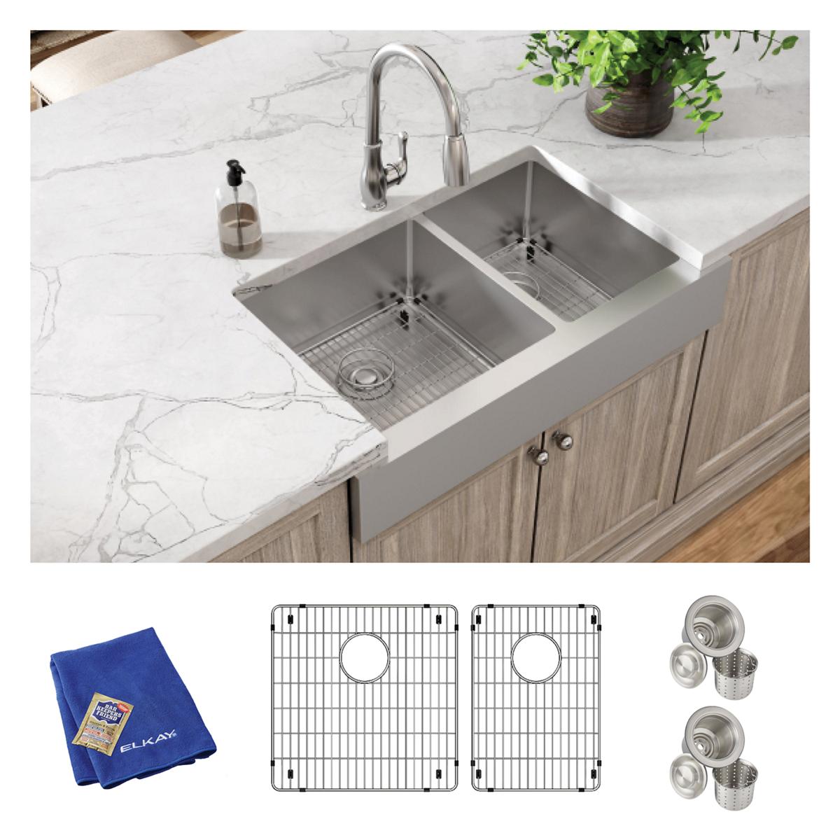 Stainless steel double bowl farmhouse sink with arched faucet, two grid inserts, strainers, and blue cleaning cloth.