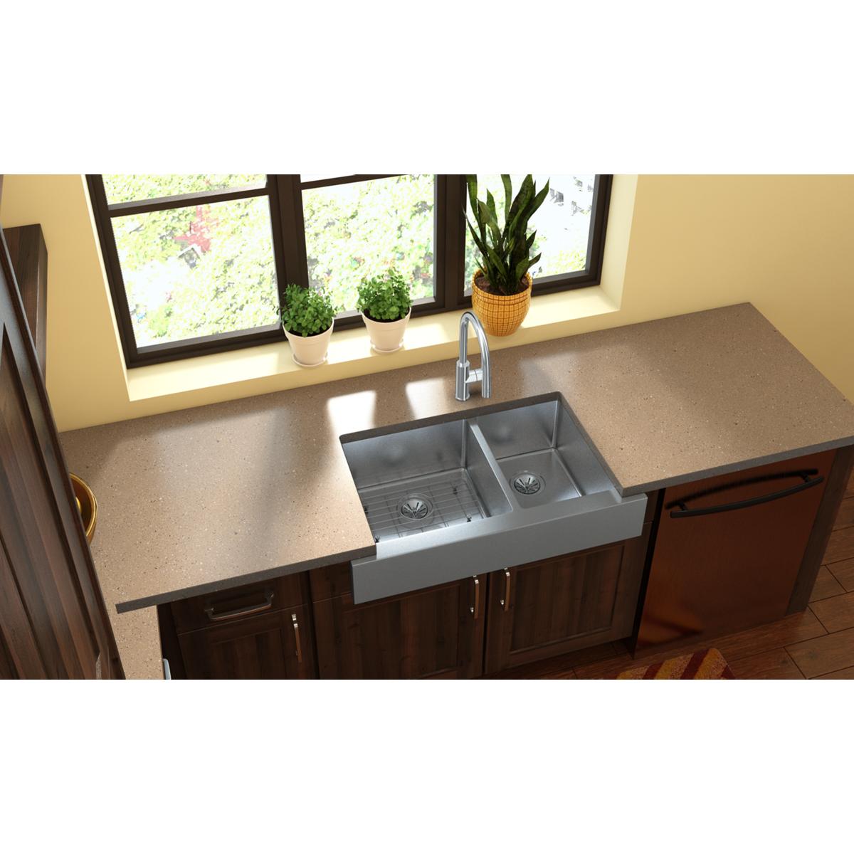 Stainless steel grid with rectangular openings designed to fit in a 16" x 16" sink basin.