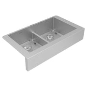 Stainless steel farmhouse sink with two equal bowls, divider, and bottom grids on apron front.