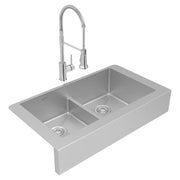 Stainless steel double bowl farmhouse sink with spray faucet and center divider.