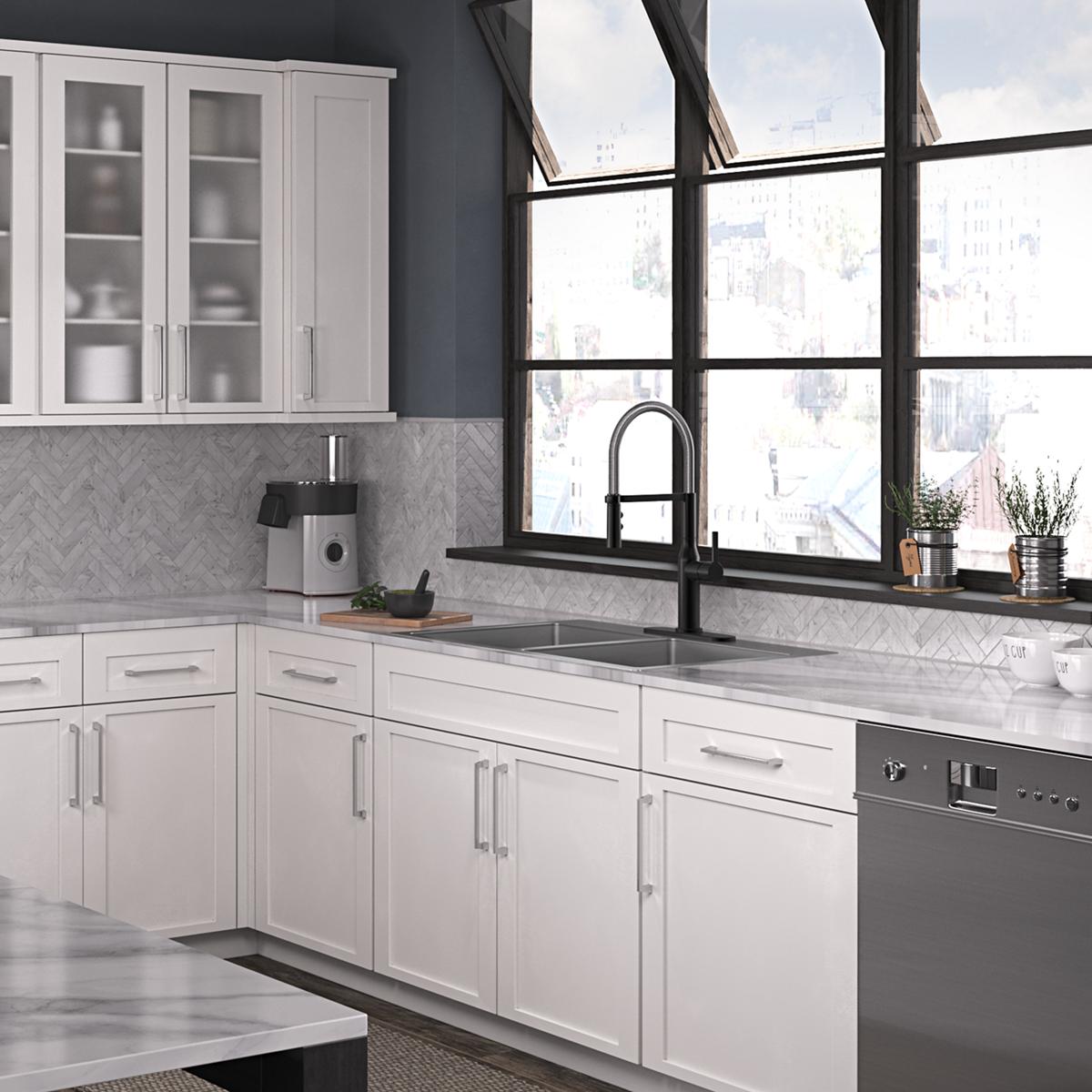 Stainless steel double bowl sink with two equal basins and three faucet holes mounted in white kitchen countertop.