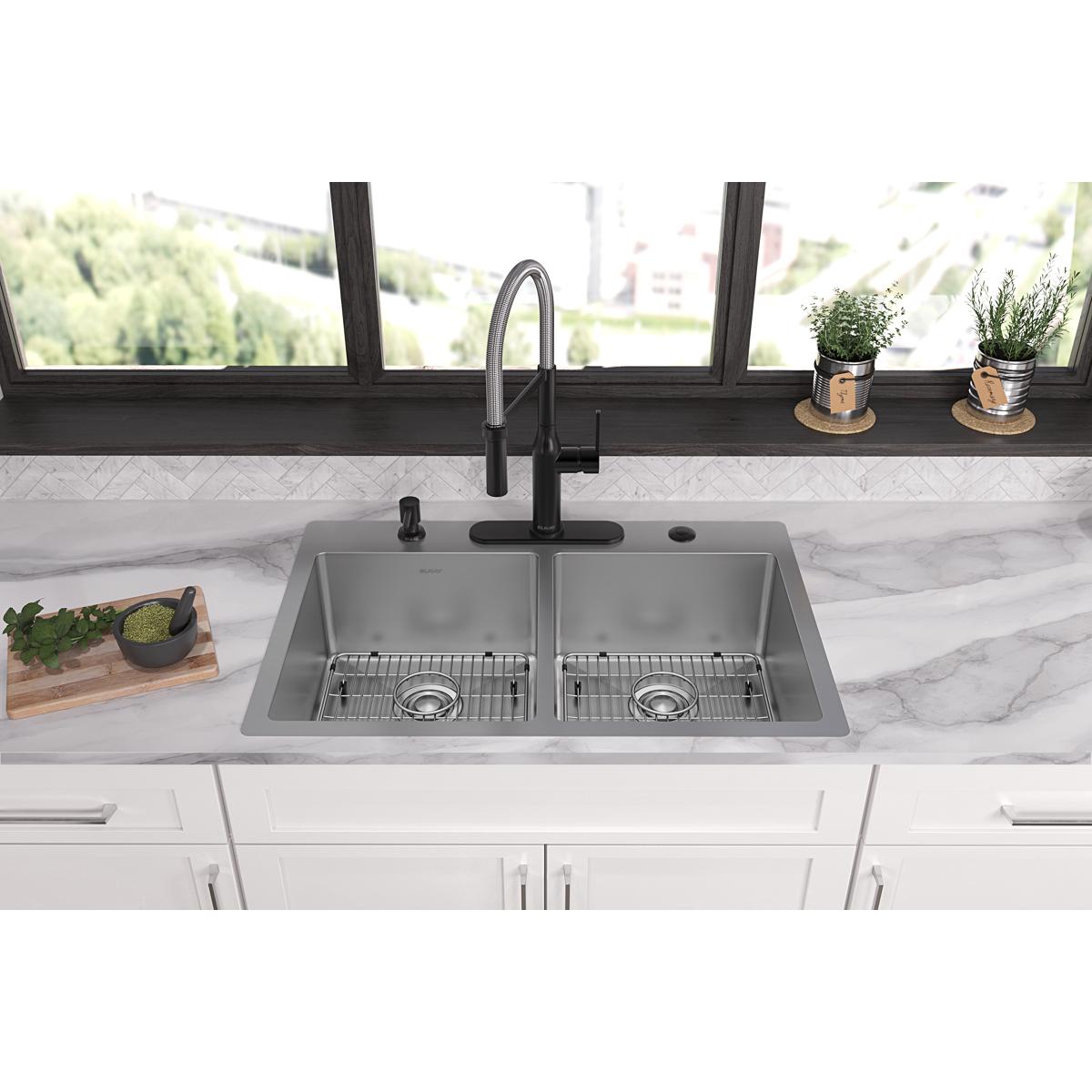 Stainless steel double bowl sink with two equal compartments, grid strainers, and black pull-down faucet mounted in white cou