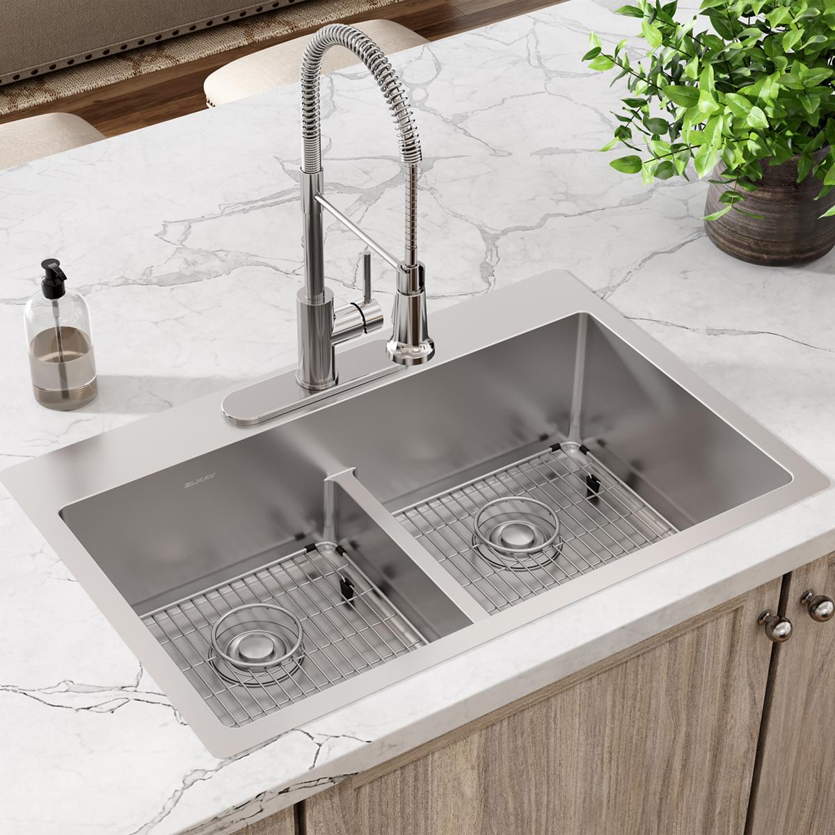 Stainless steel sink grid with horizontal wire pattern, fitted in right basin of double undermount sink.