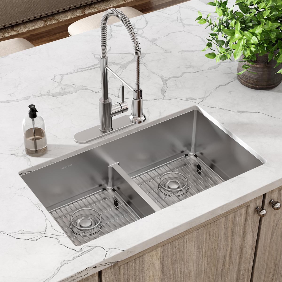 Stainless steel sink bottom grid with linear pattern, fitted in right basin of double undermount sink.