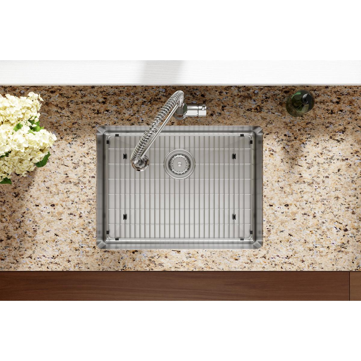Stainless steel single bowl sink with vertical ridged interior, one faucet hole, and chrome spiral faucet mounted in speckled