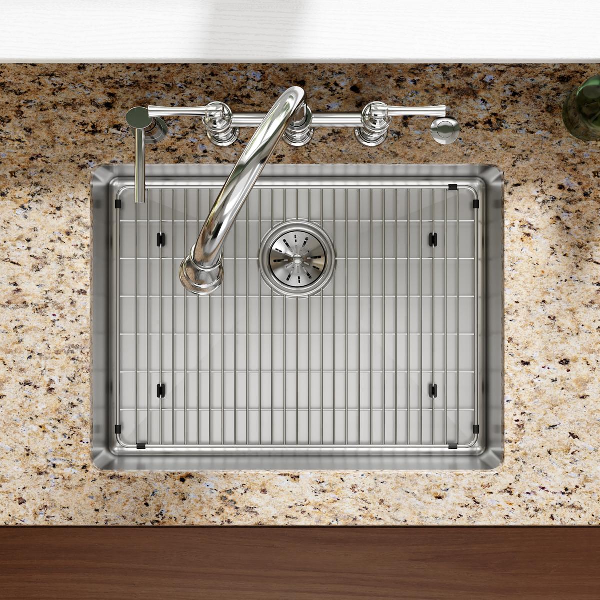 Stainless steel sink grid with vertical ribbed pattern and rubber feet, sized for 21" x 15-1/4" sink basin.