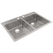 Stainless steel double bowl kitchen sink with two faucet holes, grid inserts, and drain openings.