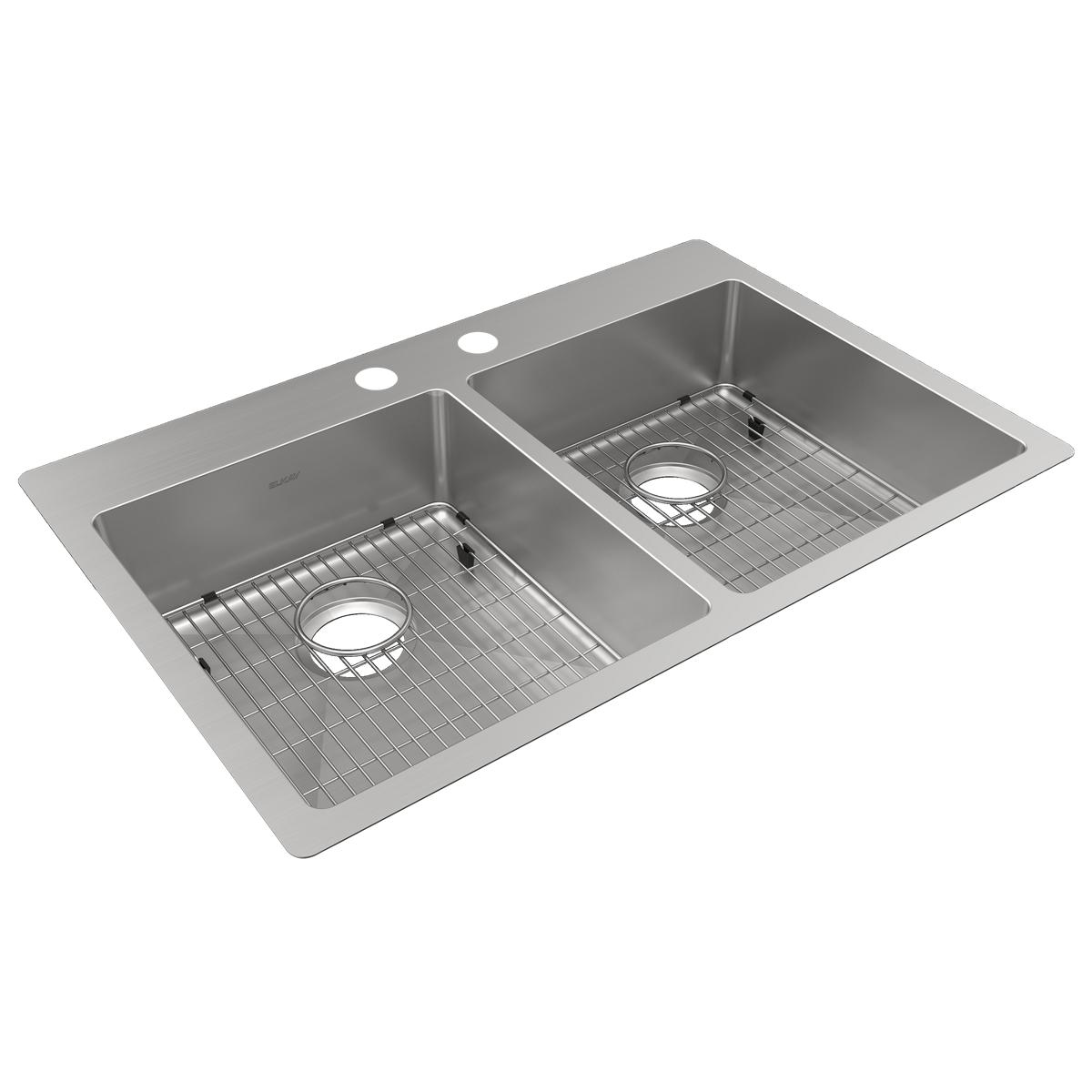 Stainless steel double bowl kitchen sink with two faucet holes, grid inserts, and drain openings.