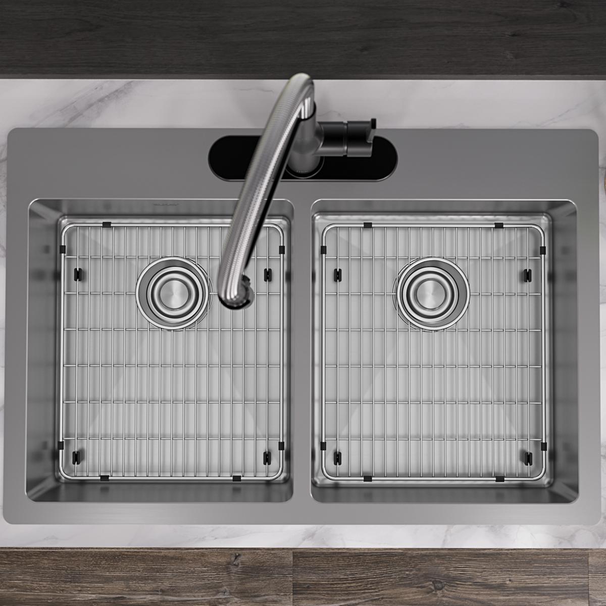 Stainless steel double bowl sink with two equal compartments, grid inserts, drain strainers, and curved faucet mounted in cou