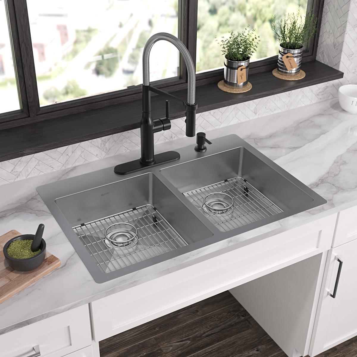 Stainless steel double bowl sink with two equal compartments, wire basin racks, and four pre-drilled holes for faucet mountin