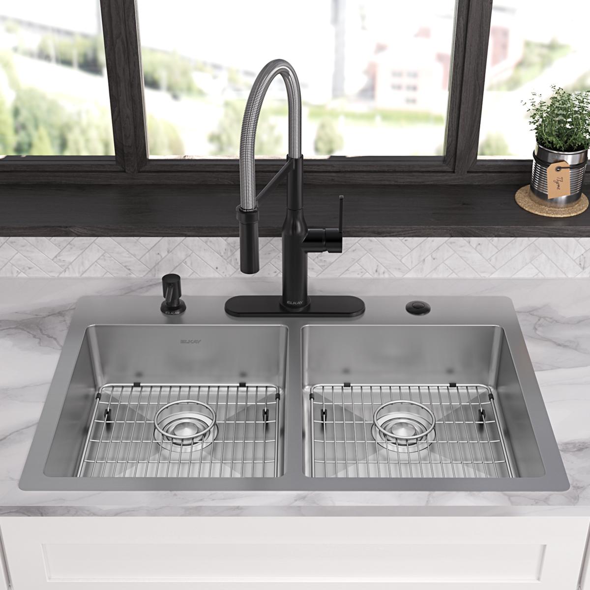 Stainless steel double bowl sink with two equal basins, grid strainers, black pull-down faucet, and five mounting holes insta