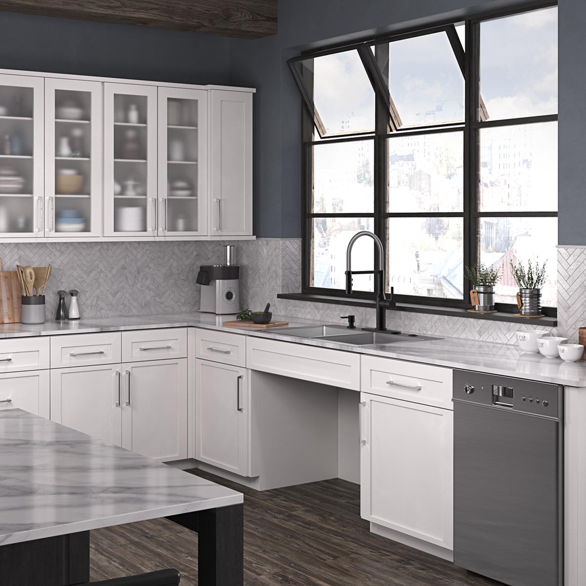 Stainless steel double bowl sink with five mounting holes installed in white kitchen cabinetry beneath black faucet and windo
