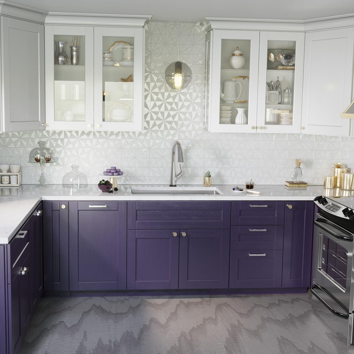 Stainless steel single bowl sink with chrome faucet installed in purple kitchen cabinet countertop.