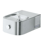 Stainless steel wall-mounted water fountain with single bottle filler spout and soft sides, ADA compliant design.