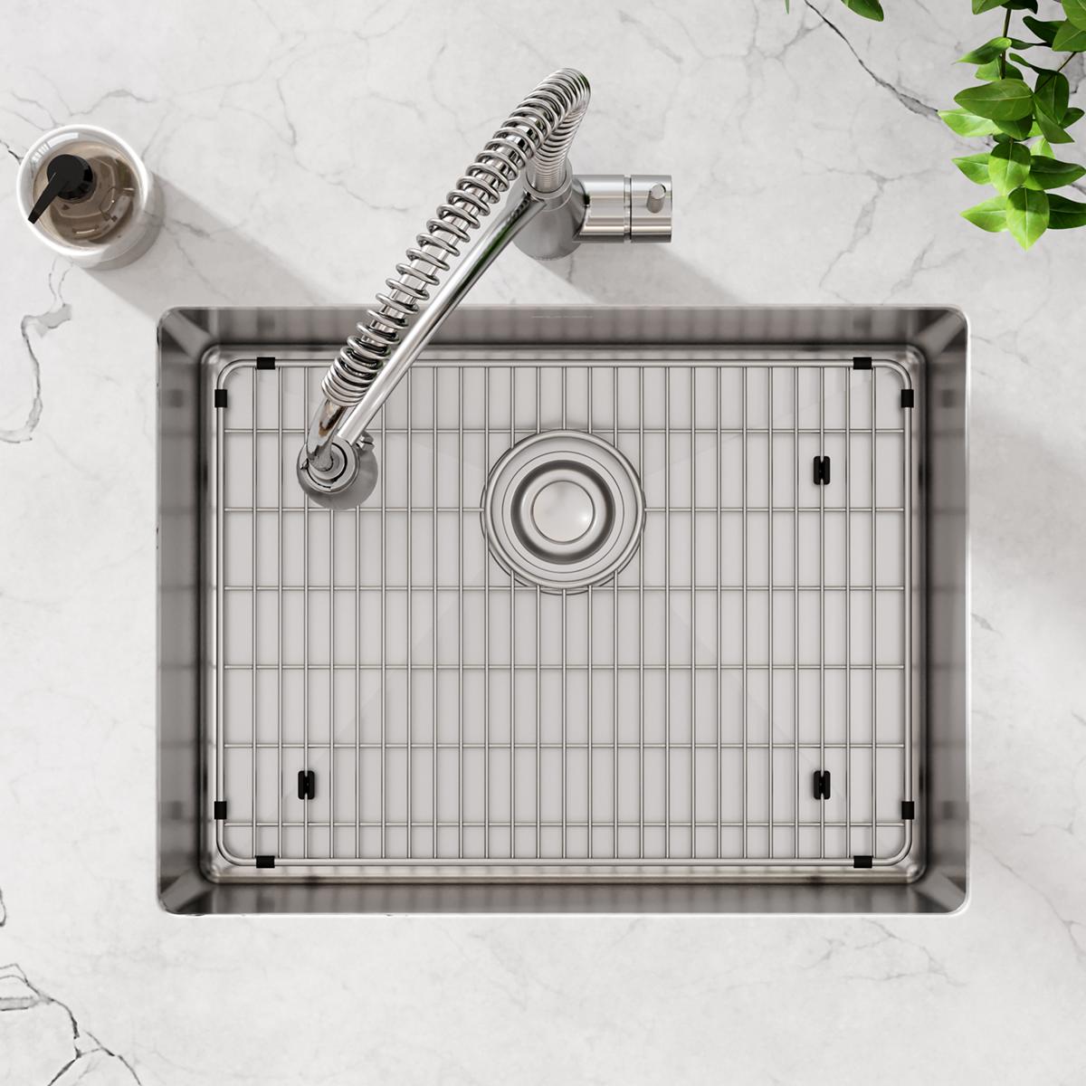Stainless steel single bowl undermount sink with grid insert, spiral pull-down faucet, and drain strainer, viewed from above 