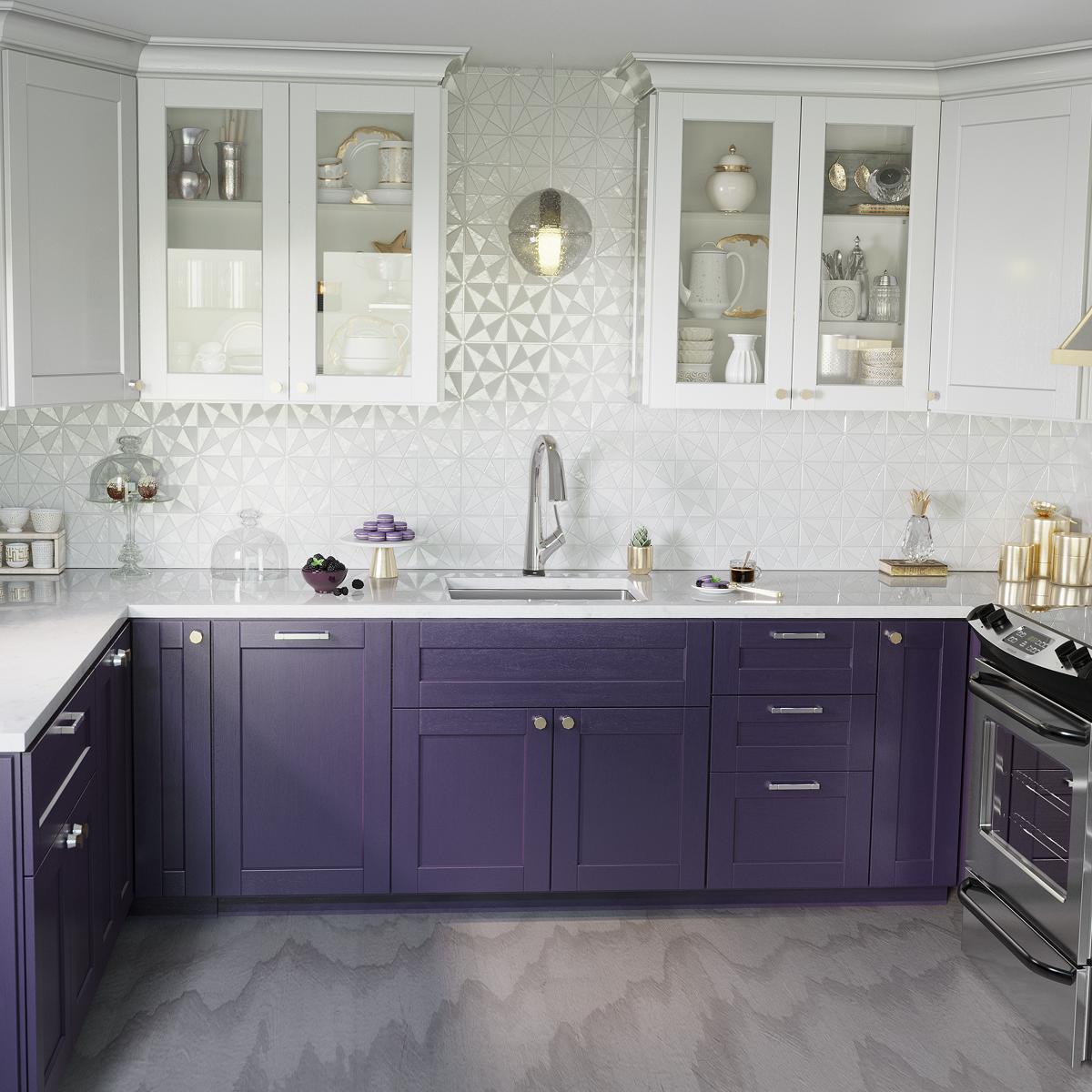 Stainless steel single bowl undermount sink with pull-down filtered faucet installed in purple kitchen cabinetry with white c