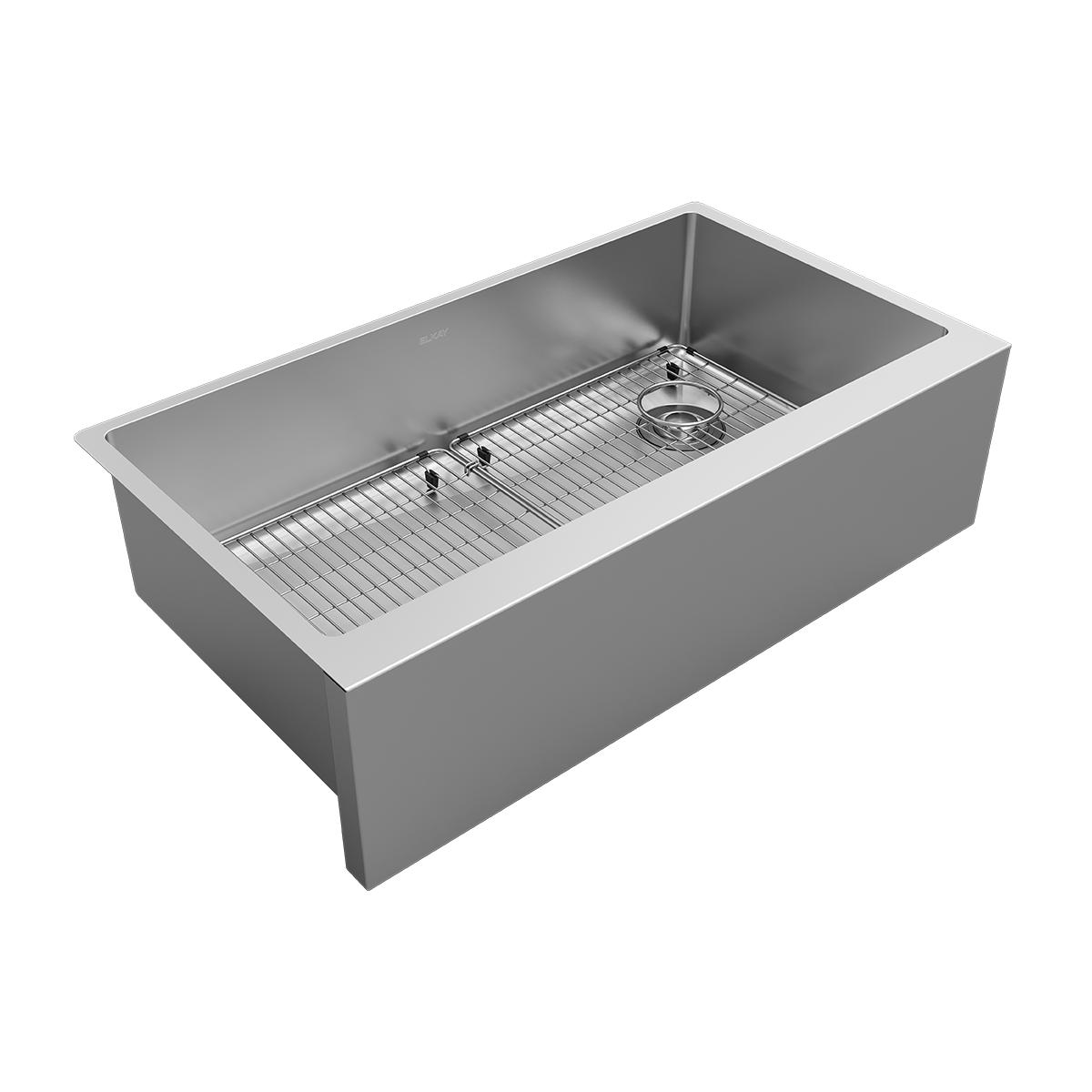 Stainless steel single bowl farmhouse sink with grid rack and drain assembly.