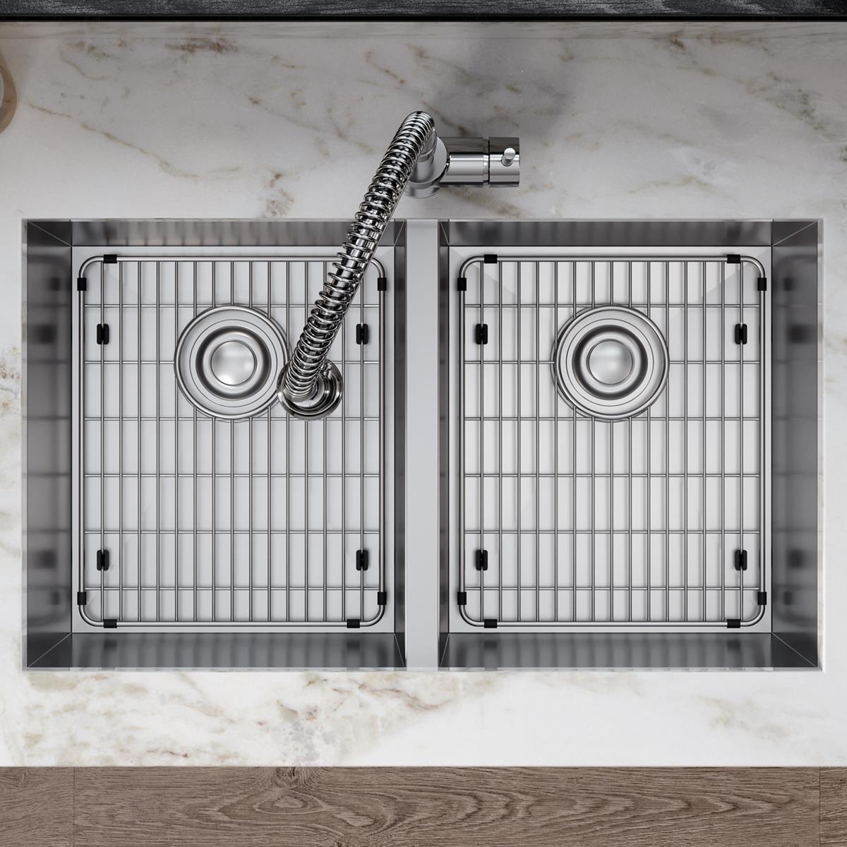 Stainless steel sink grid with vertical stripes and rubber feet, shown installed in double basin sink.