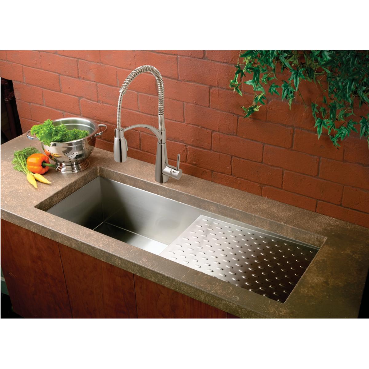 Chrome kitchen faucet with flexible spout and single lever handle installed above stainless steel sink basin.