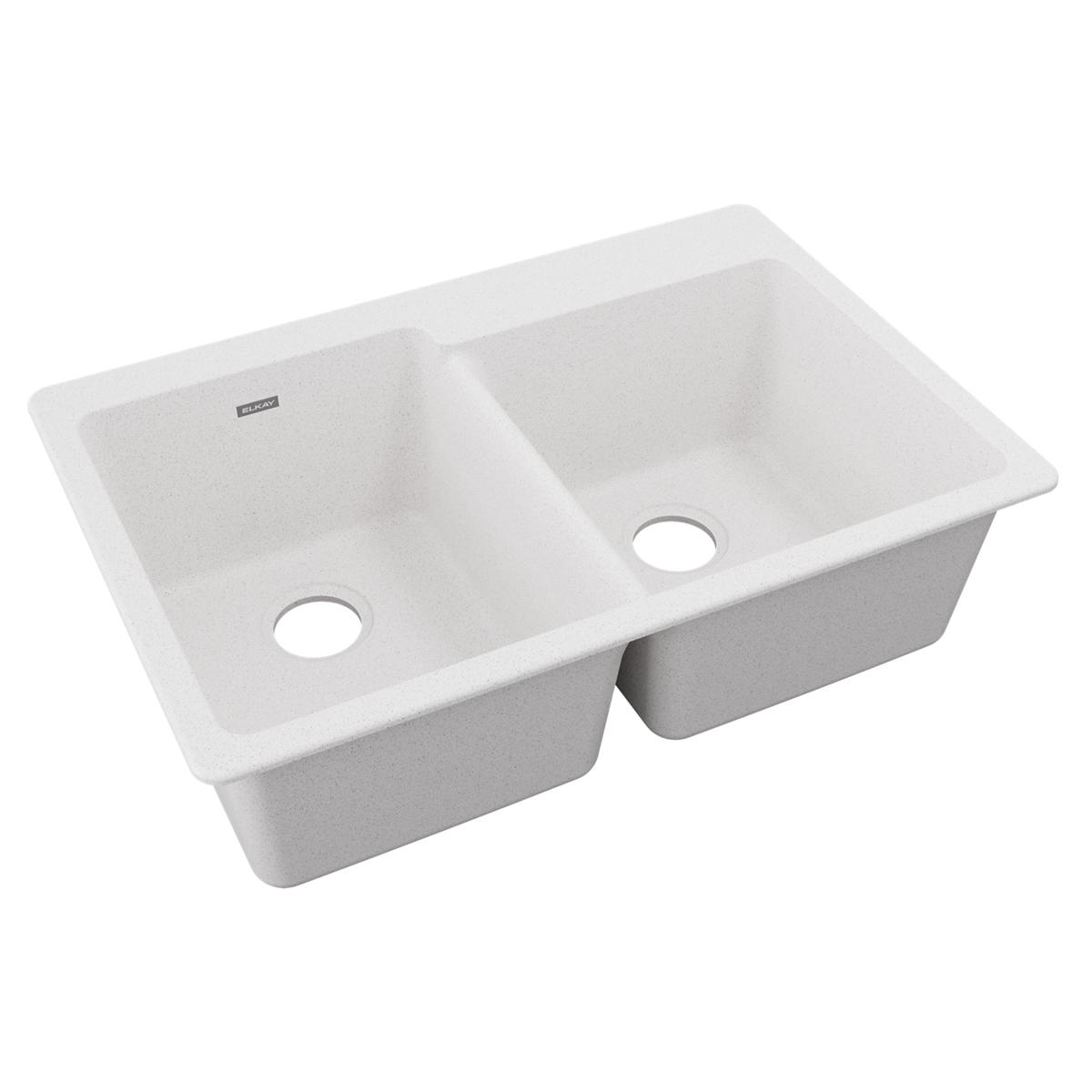 White quartz double bowl drop-in sink with offset bowls and drain holes visible.