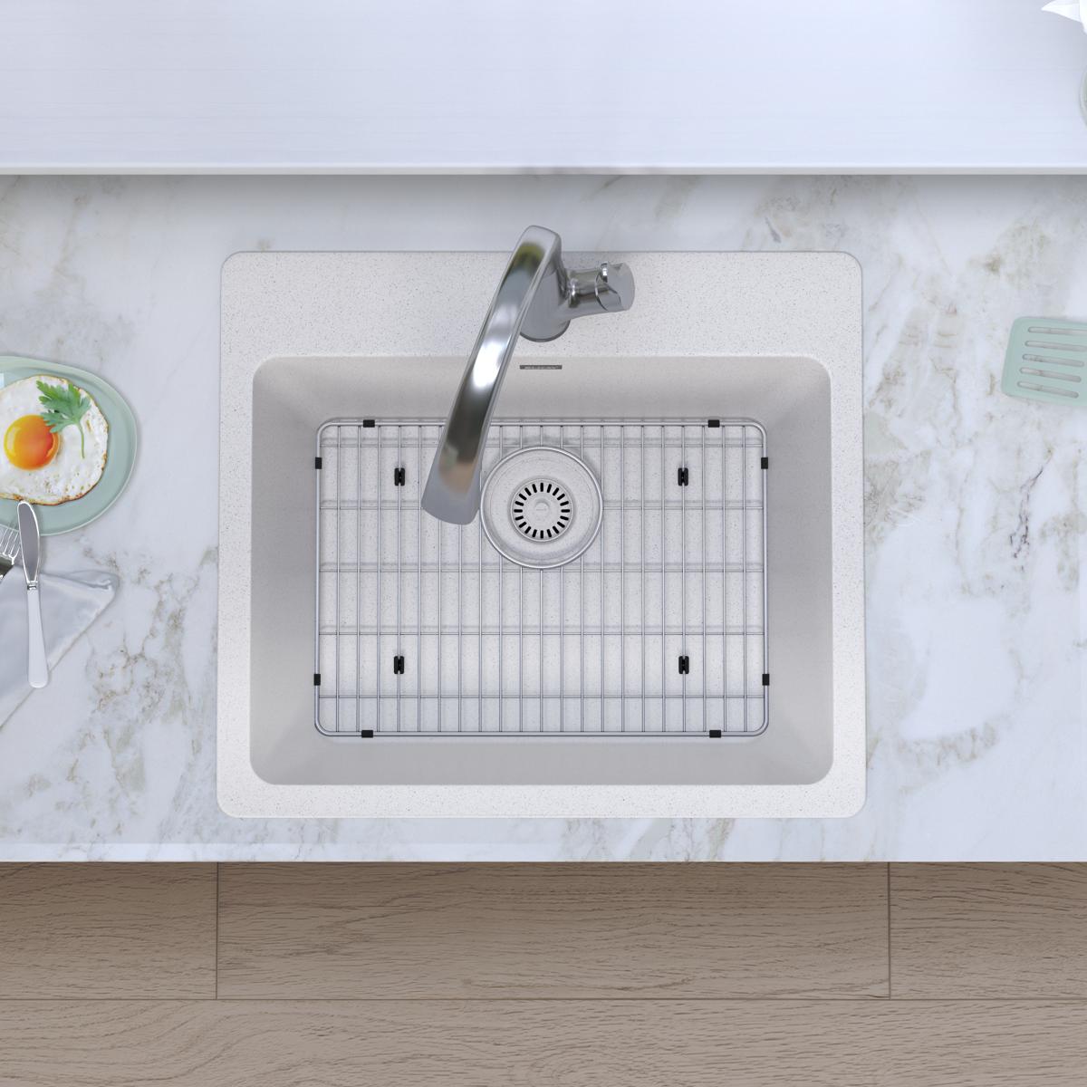 White quartz single bowl drop-in sink with stainless steel filtered faucet and grid insert, shown installed in marble counter