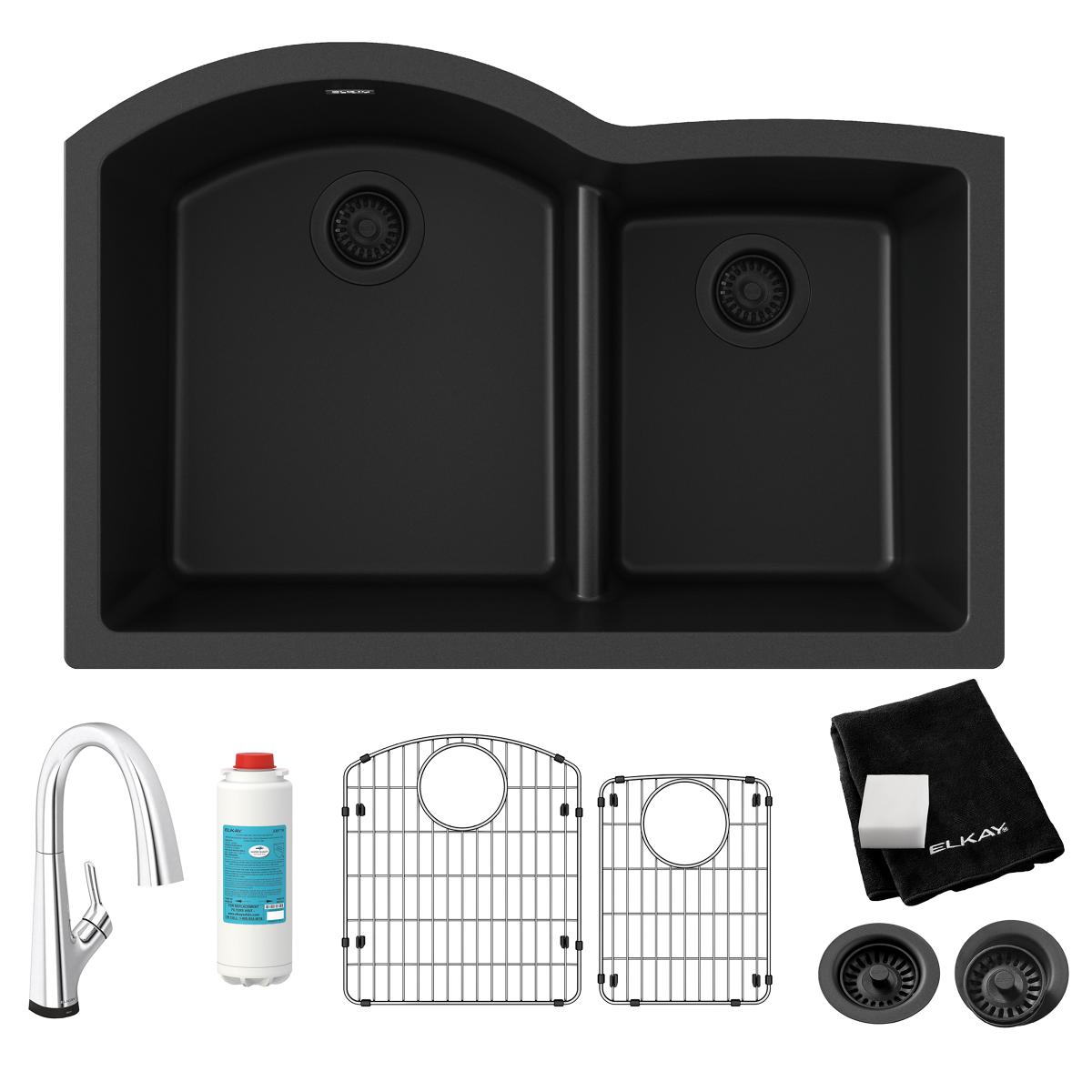 Black quartz double bowl undermount sink with filtered faucet, grids, strainers, and care cloth.