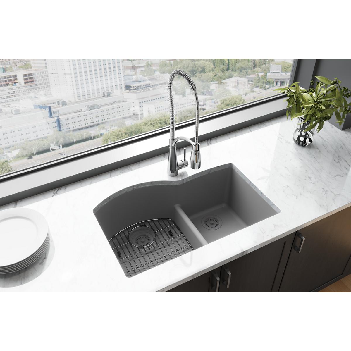 Greystone quartz double bowl undermount sink with offset 60/40 configuration and divider, installed in white countertop with 