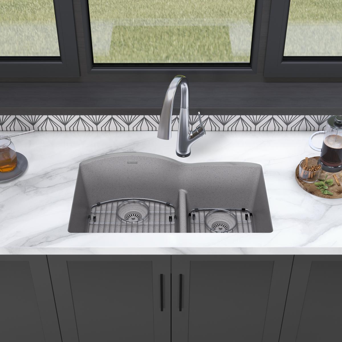 Greystone quartz double bowl undermount sink with offset 60/40 configuration, dual drain grids, and chrome filtered faucet in