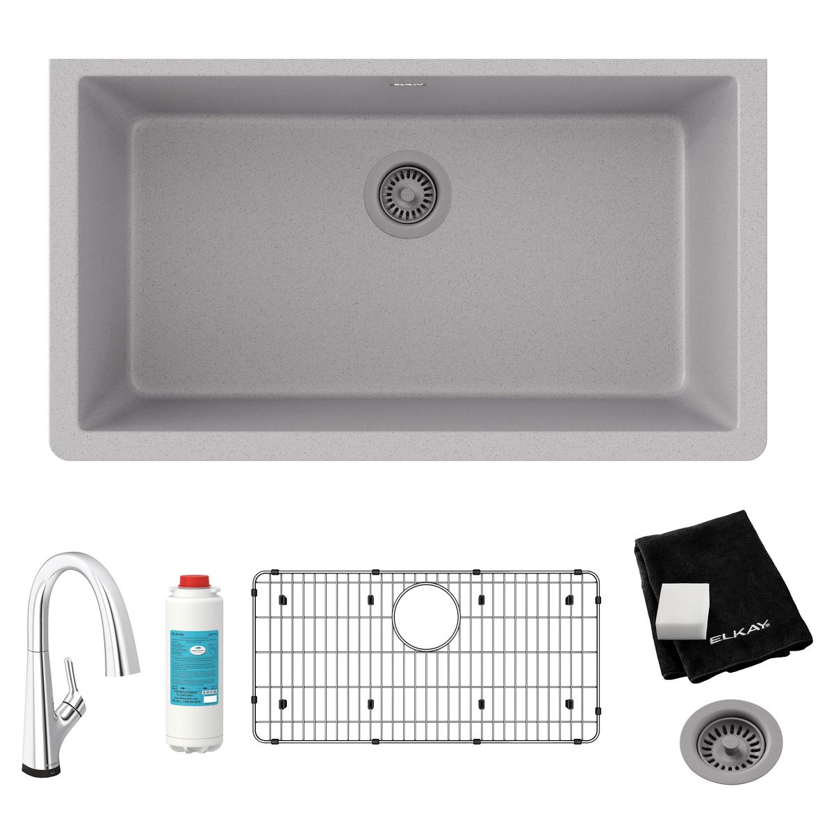 Greystone quartz single bowl undermount sink kit with filtered faucet, sink grid, drain, and black cloth.