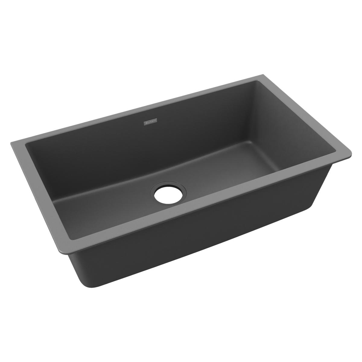 Dusk gray quartz single bowl undermount sink with drain hole and sloped interior.